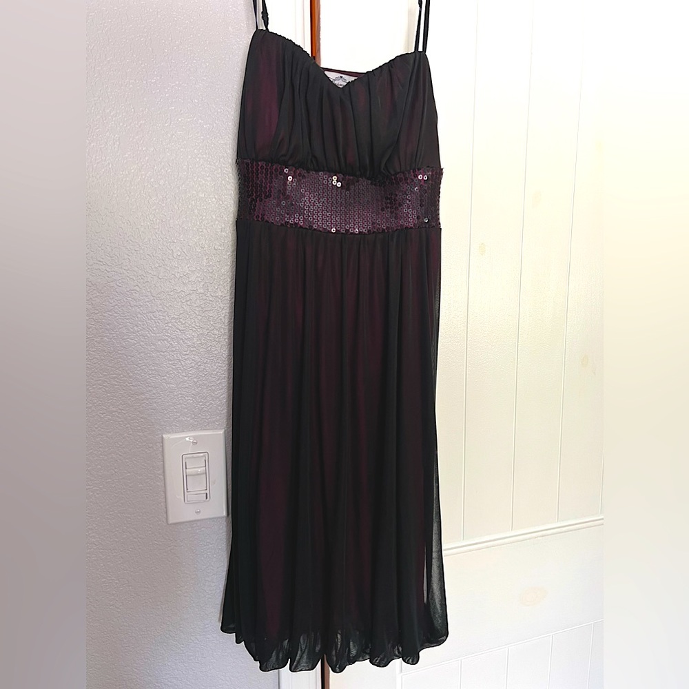Short black sheer dress with hot pink undertone.